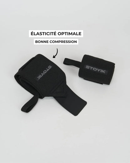 Bandes de poignets STOYIK noires partiellement enroulées montrant la texture et le système de fixation
